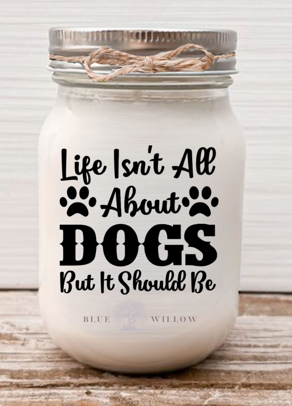 Candle that says, life isnt all about dogs but it should be, scent is zen coconut