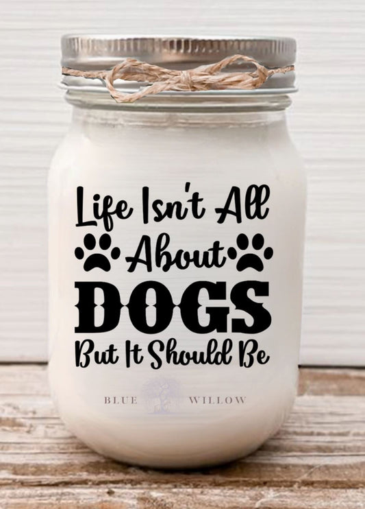 Candle that says, life isnt all about dogs but it should be, scent is zen coconut