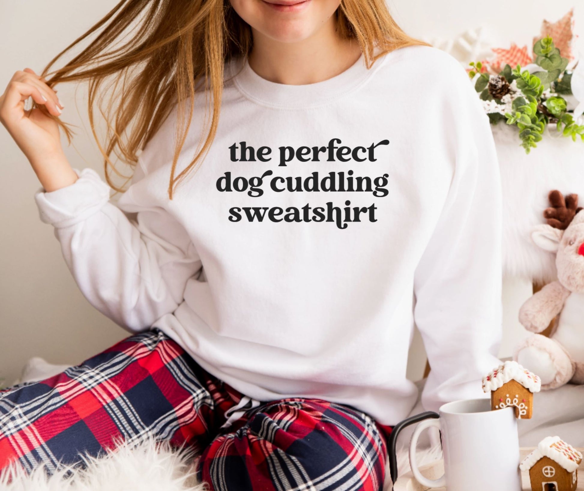 white sweatshirt that says, the perfect dog cuddling sweatshirt