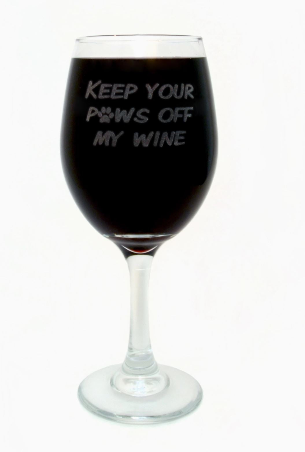 Wine glass that reads, keep your paws off my wine